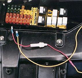 Showing the male blade connectors and the in-line fuse.